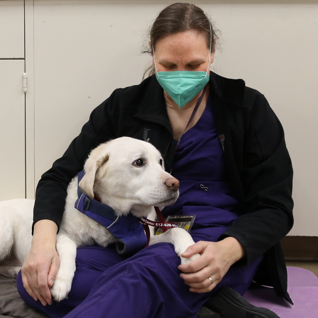 Siri Rea with a yellow lab dog