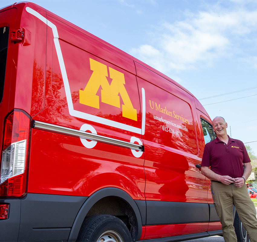 Jeff Ryg in front of a red U Market Services van